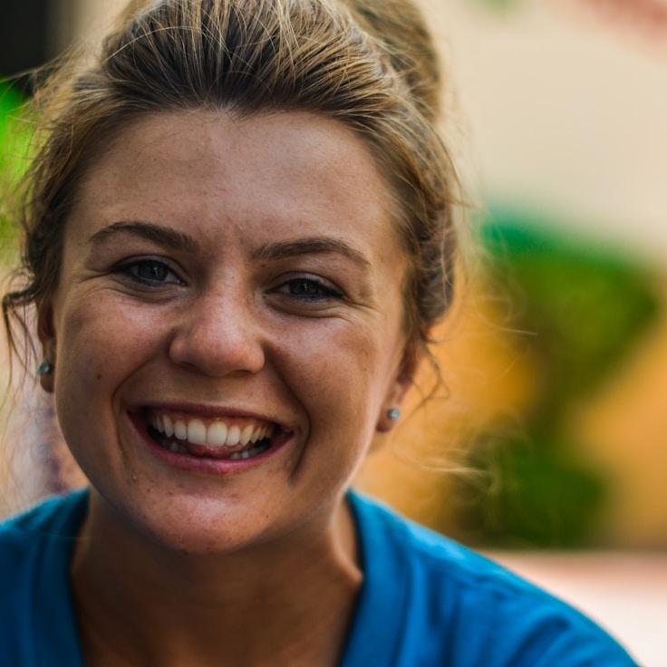 Kaveri Mehta, Lead Design Curator at Eluvionix Global, reviewing corporate floral arrangements